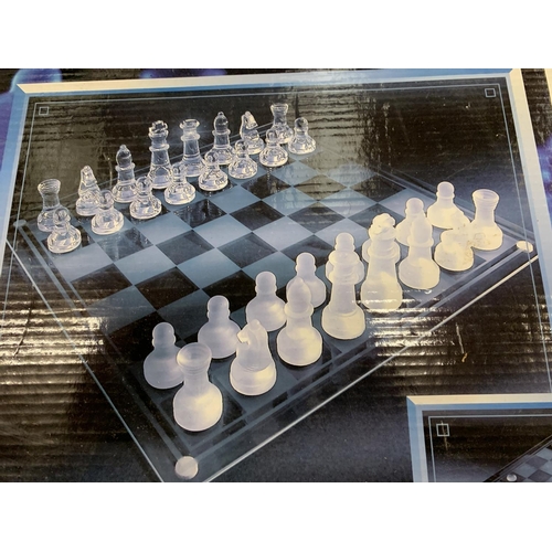 162 - A NEW AND BOXED LIMITED EDITION ELEGANT GLASS CHESS AND CHECKER SET