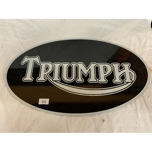 173 - AN OVAL 'TRIUMPH' METAL SIGN 24 INCHES BY 14 INCHES