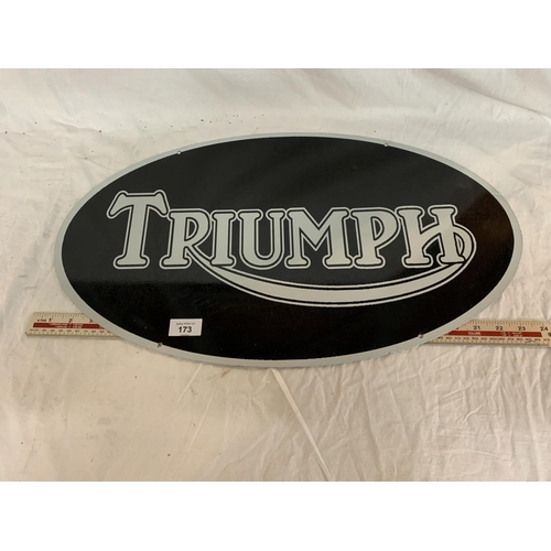 173 - AN OVAL 'TRIUMPH' METAL SIGN 24 INCHES BY 14 INCHES