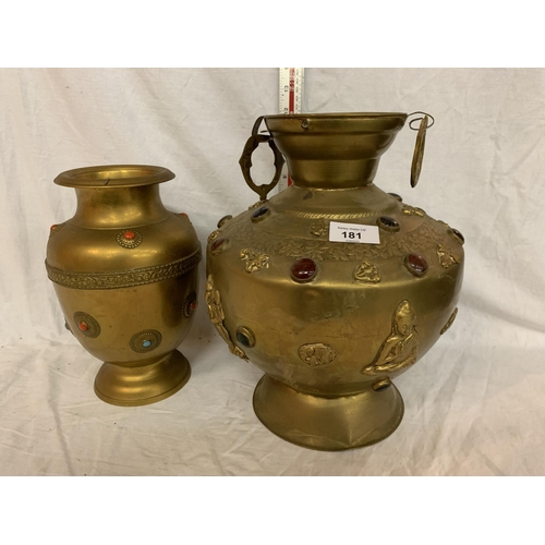 181 - TWO LARGE BRASS POTS WITH ASSORTED STONES ONE WITH ORNATE DETAILING