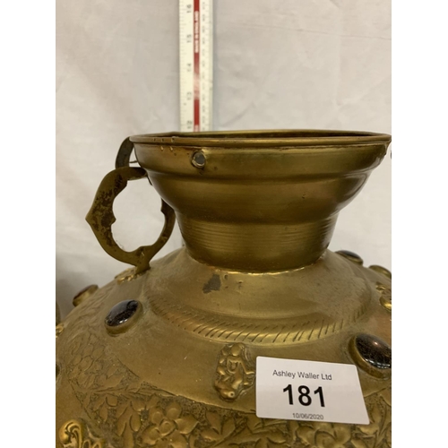 181 - TWO LARGE BRASS POTS WITH ASSORTED STONES ONE WITH ORNATE DETAILING