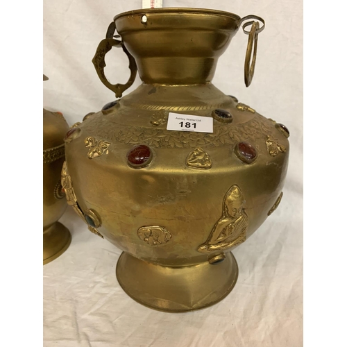 181 - TWO LARGE BRASS POTS WITH ASSORTED STONES ONE WITH ORNATE DETAILING