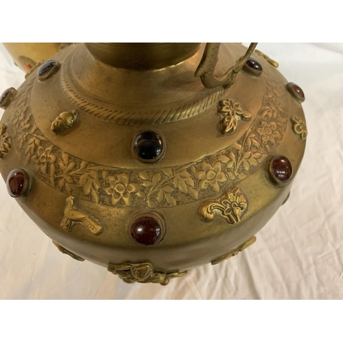 181 - TWO LARGE BRASS POTS WITH ASSORTED STONES ONE WITH ORNATE DETAILING