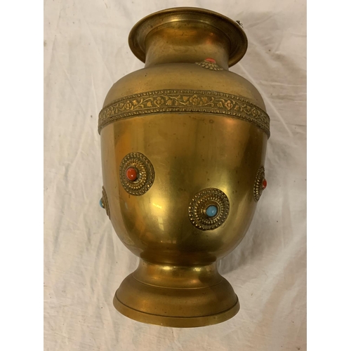 181 - TWO LARGE BRASS POTS WITH ASSORTED STONES ONE WITH ORNATE DETAILING