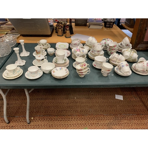 196 - A LARGE COLLECTION OF VARIOUS CHINA TEA CUPS AND SAUCERS ETC