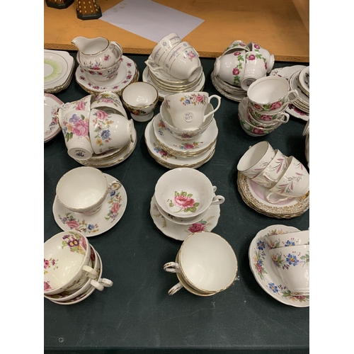 196 - A LARGE COLLECTION OF VARIOUS CHINA TEA CUPS AND SAUCERS ETC