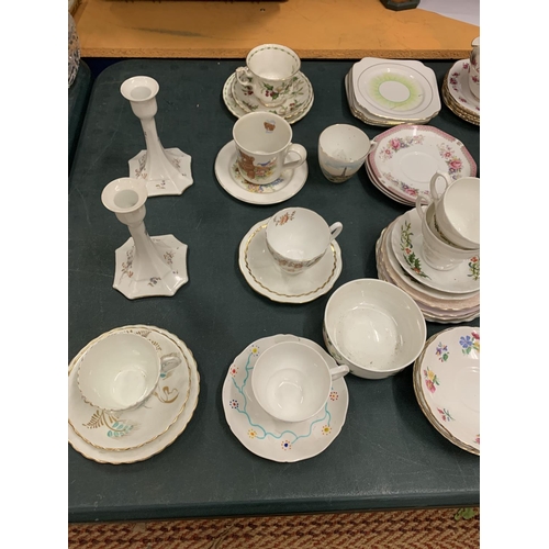 196 - A LARGE COLLECTION OF VARIOUS CHINA TEA CUPS AND SAUCERS ETC