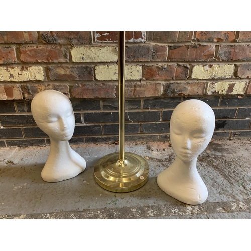 215 - A MANNEQUIN ON A BRASS COLOURED STAND AND A PAIR OF POLYSYTRENE HEADS