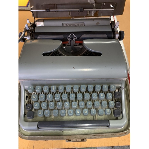 233 - A VINTAGE CASED BLUE BIRD TYPE WRITER