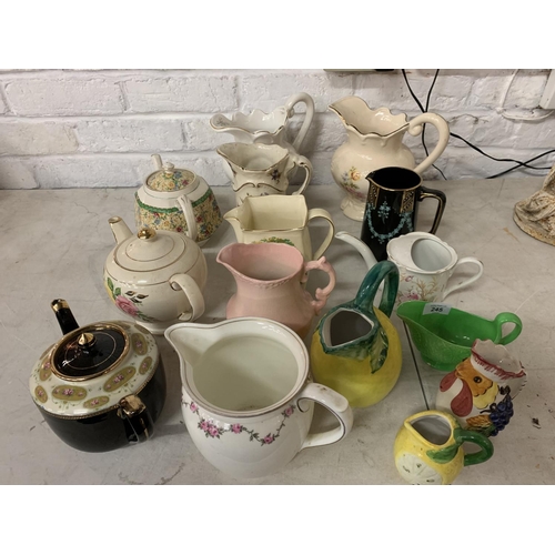 245 - A QUANTITY OF VARIOUS JUGS AND TEA POTS