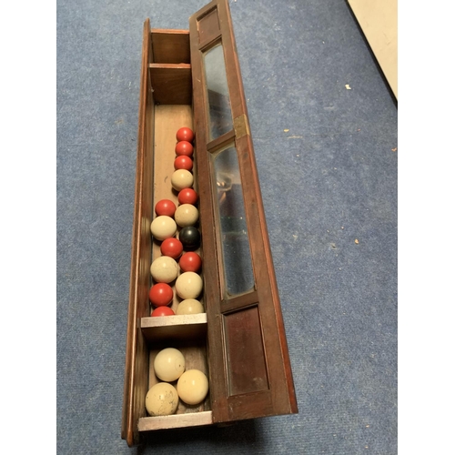 257 - A VINTAGE WOODEN AND GLASS SNOOKER/BILLIARD BALL STORAGE CABINET WITH VARIOUS BALLS