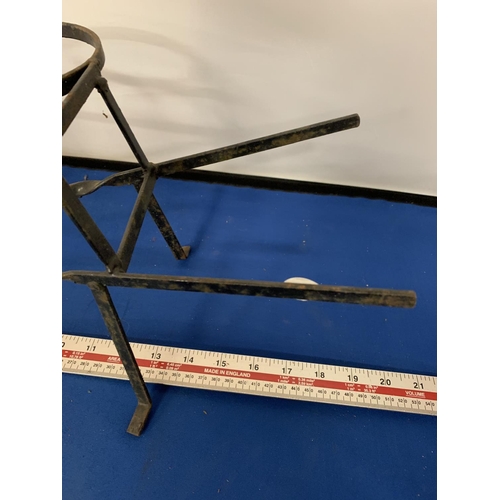 268 - A WROUGHT IRON PLANT POT HOLDER IN THE FORM OF A WHEELBARROW