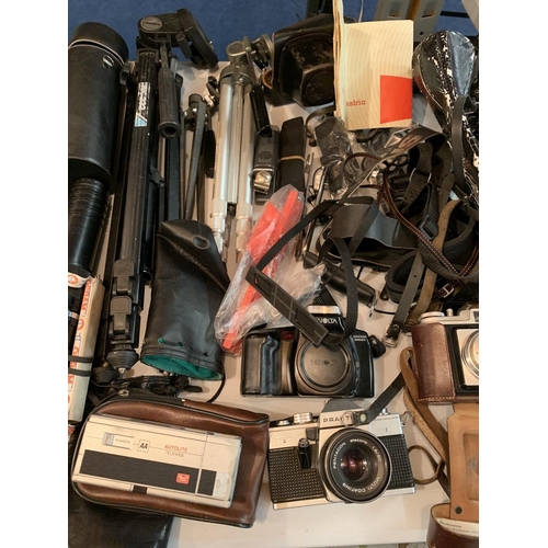 288 - A LARGE COLLECTION OF CAMERAS, LENSES, TRIPODS, CASES, FLASHES ETC