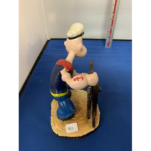 292 - A CAST IRON POPEYE WITH A SHIPS WHEEL FIGURE