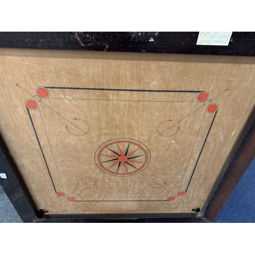 298 - A LARGE VINTAGE WOODEN FRAMED CARROM BOARD WITH A BOX OF COUNTERS