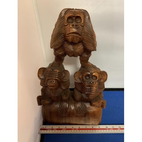 446 - A LARGE WOODEN MONKEY CARVING ' SEE NO EVIL, SPEAK NO EVIL, HEAR NO EVIL'