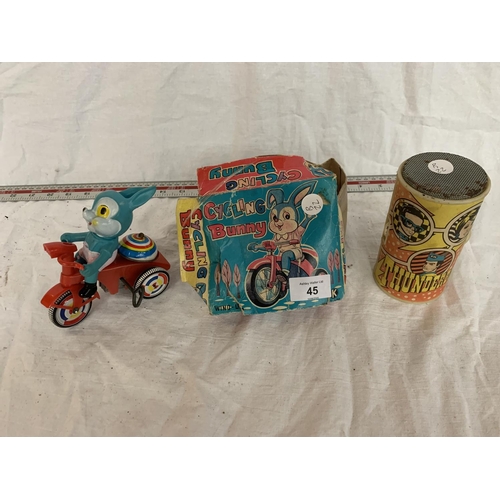 45 - A VINTAGE BOXED RABBIT ON A BIKE AND A THUNDERBIRDS RADIO