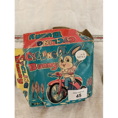 45 - A VINTAGE BOXED RABBIT ON A BIKE AND A THUNDERBIRDS RADIO