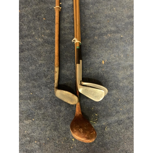 451 - THREE VINTAGE GOLF CLUBS