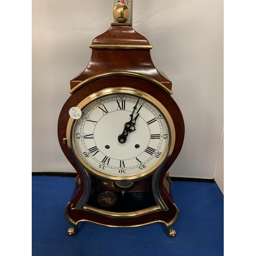 486 - A MAHOGANY AND GILT MANTLE CLOCK