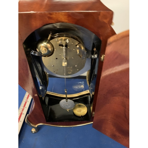 486 - A MAHOGANY AND GILT MANTLE CLOCK