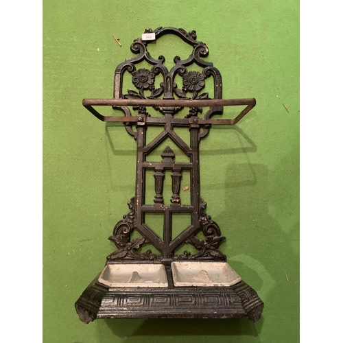 489 - A CAST METAL STICK/UMBRELLA STAND WITH BOTH TRAYS