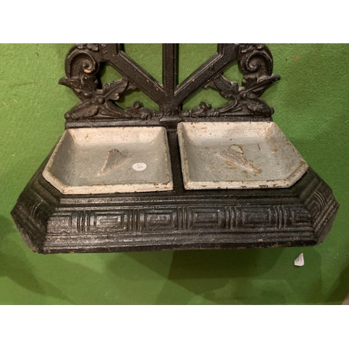 489 - A CAST METAL STICK/UMBRELLA STAND WITH BOTH TRAYS