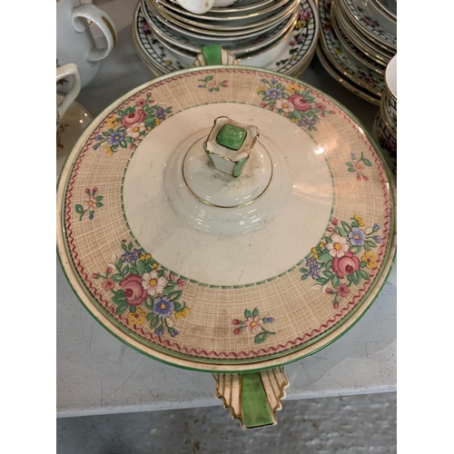 496 - A LARGE COLLECTION OF CHINA CUPS AND SAUCERS AND A LOLSOL ART DECO STYLE SERVING DISH