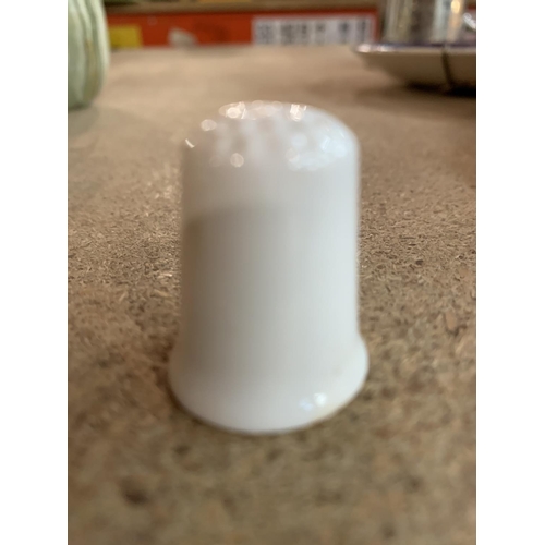 651 - A VERY LARGE QUANTITY OF WHITE CERAMIC THIMBLES