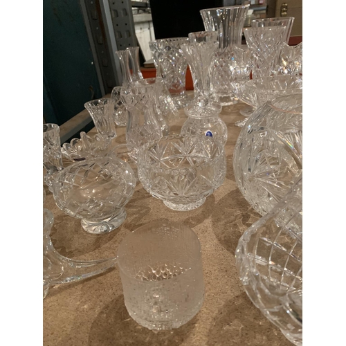 658 - A LARGE COLLECTION OF CUT GLASS ITEMS TO INCLUDE BASKETS, VASES, BOWLS, CANDLESTICKS ETC