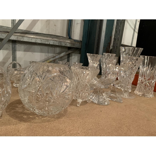 658 - A LARGE COLLECTION OF CUT GLASS ITEMS TO INCLUDE BASKETS, VASES, BOWLS, CANDLESTICKS ETC