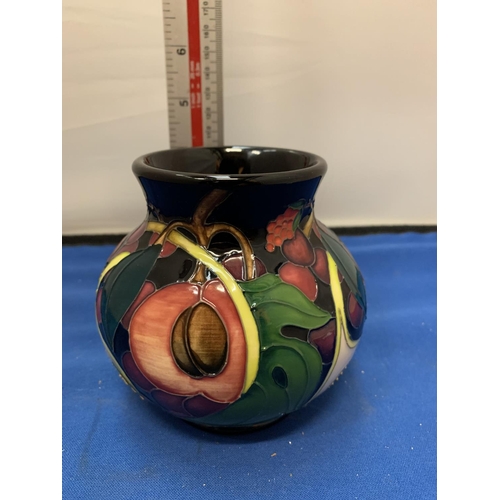 675 - A MOORCROFT 4 INCH QUEEN'S CHOICE VASE