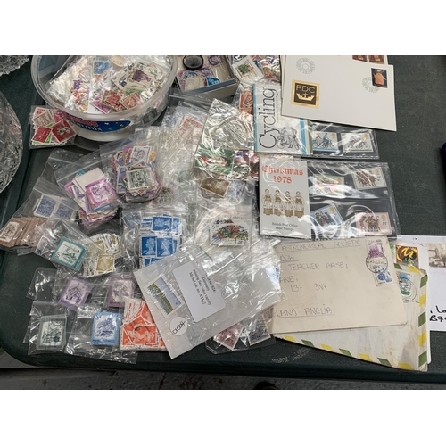 75 - A LARGE COLLECTION OF LOOSE STAMPS AND FIRST DAY COVERS