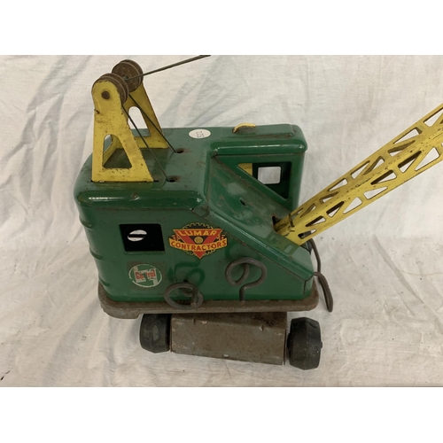 83 - A VINTAGE TIN PLATE TOY CRANE