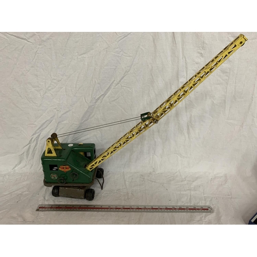 83 - A VINTAGE TIN PLATE TOY CRANE