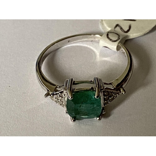 646 - A 9 CARAT WHITE GOLD, DIAMOND AND EMERALD RING (0.06 CARAT) - RING SIZE M