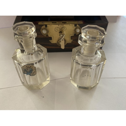 704 - A SMALL COROMANDEL WOOD CHEST CONTAINING TWO GLASS SCENT BOTTLES