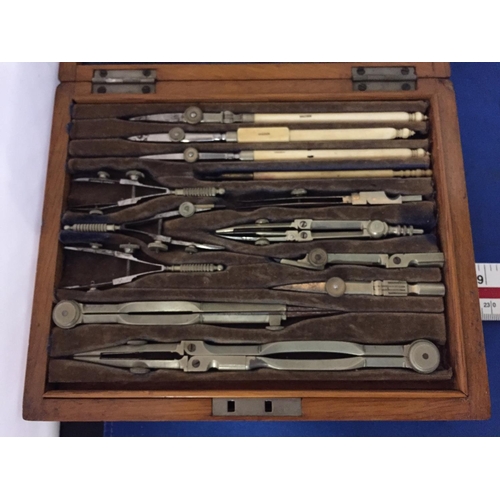 479 - A VINTAGE OAK BOXED TRIGONOMETRY SET