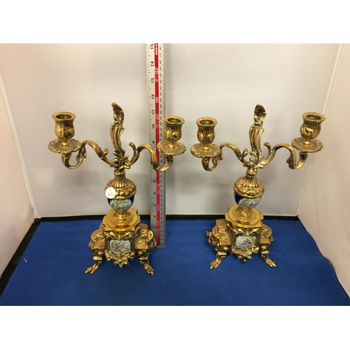 481 - A PAIR OF ORNATE BRASS CANDLEABRAS