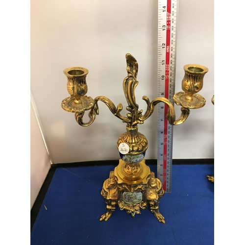 481 - A PAIR OF ORNATE BRASS CANDLEABRAS