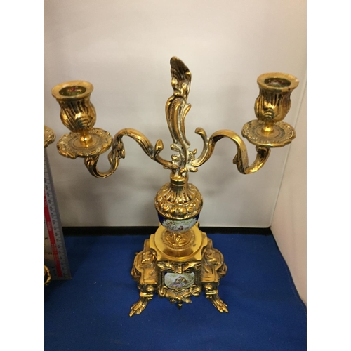 481 - A PAIR OF ORNATE BRASS CANDLEABRAS