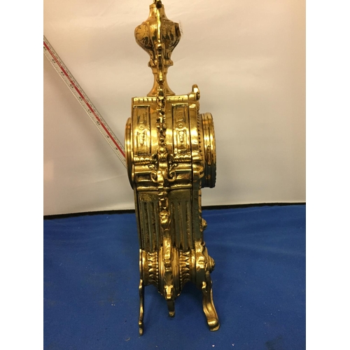 484 - A BRASS CARVED MANTLE CLOCK