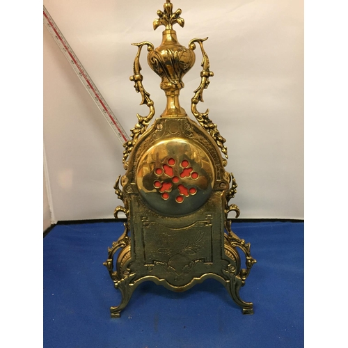 484 - A BRASS CARVED MANTLE CLOCK