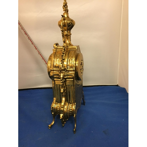 484 - A BRASS CARVED MANTLE CLOCK