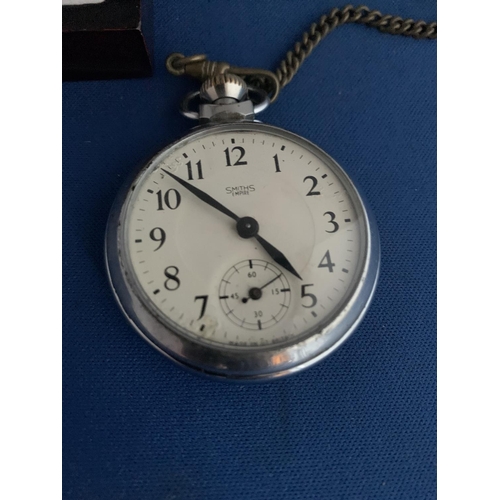 549 - SMITHS EMPIRE CHROME POCKET WATCH WITH BASE METAL CHAIN WITH SILVER ST CHRISTOPHER ATTACHED