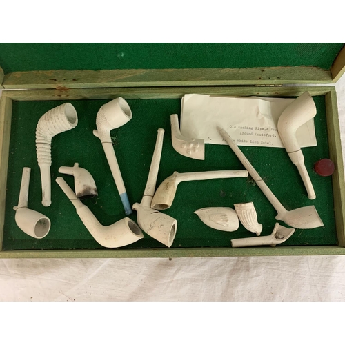 711 - EARLY 20TH CENTURY COLLECTION OF CLAY PIPES VARYING SIZES, HOUSED WITHIN A WOODEN CASE