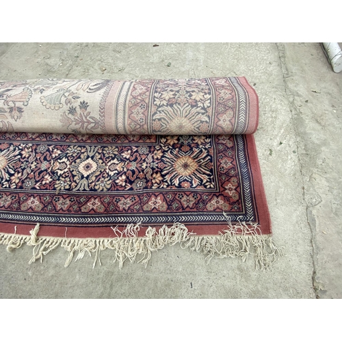 1494 - A LARGE RED PATTERNED RUG - WIDTH 250 CM