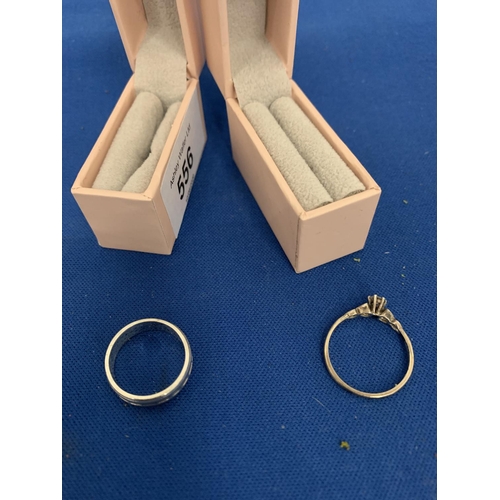 556 - TWO BOXED SILVER RINGS ONE STONE SET THE OTHER A BAND RING