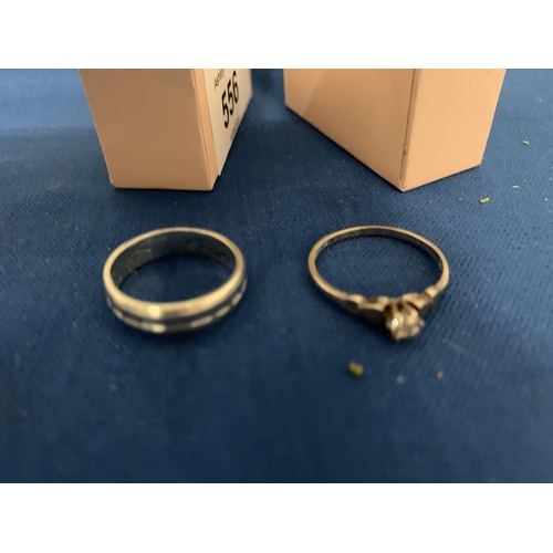 556 - TWO BOXED SILVER RINGS ONE STONE SET THE OTHER A BAND RING