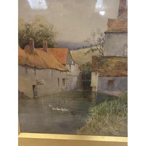 763 - A GILT FRAMED WATERCOLOUR OF HOUSES, SIGNED LOWER RIGHT CORNER GEOFF HUGHES